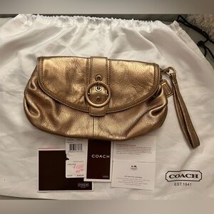 Coach Ali Leather Rose Gold Metallic Wristlet Clutch.